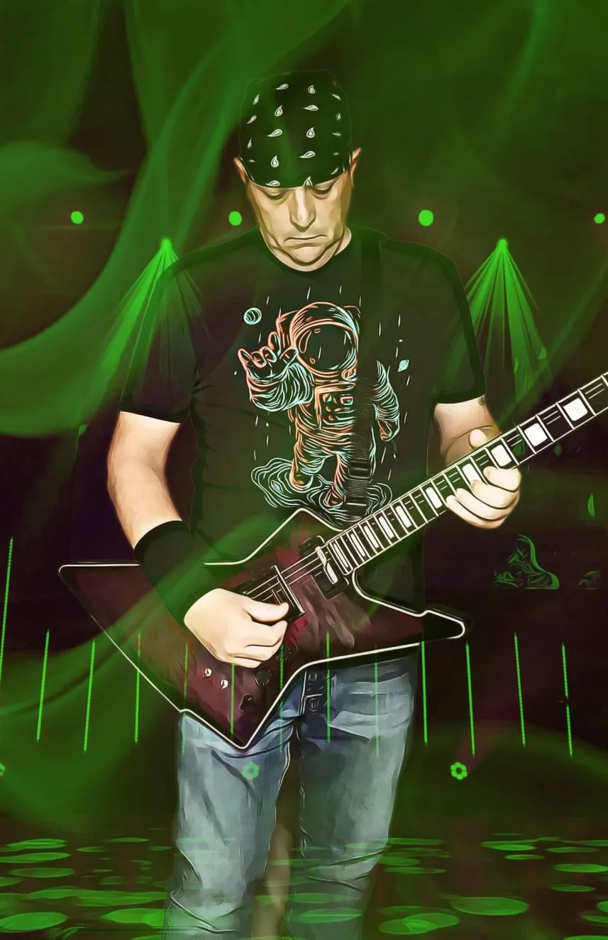 Ace Parlier playing guitar on stage under green light