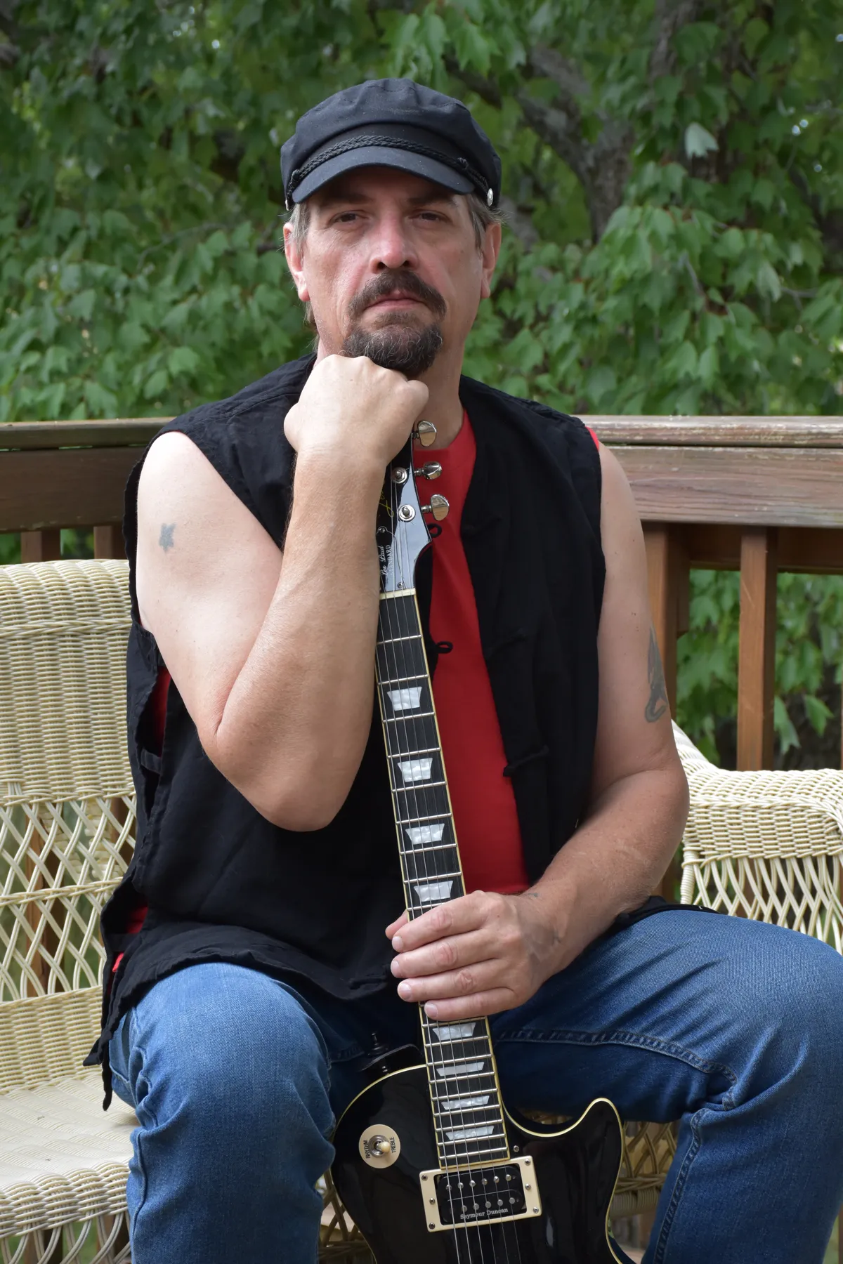 Ace Parlier playing a Les Paul guitar outdoors